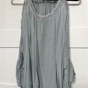 Pretty light blue top with cut out sleeves.